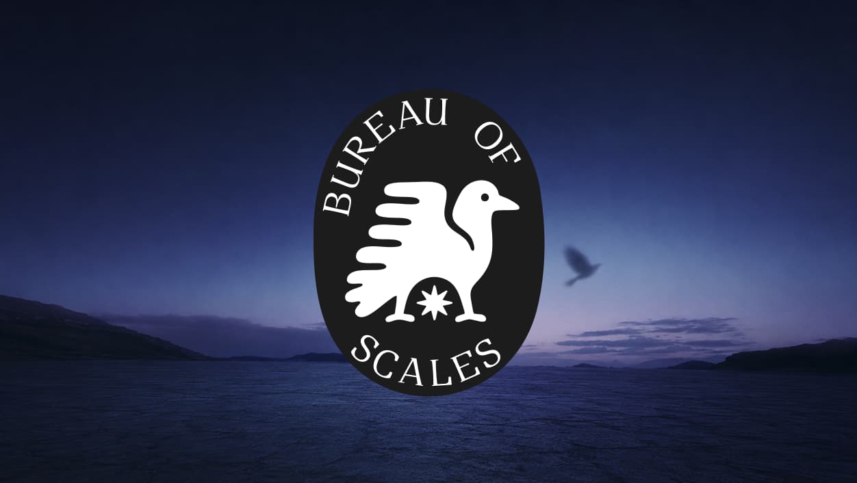 Alternative Bureau of Scales proposal featuring a bird emblem over a coastal landscape.